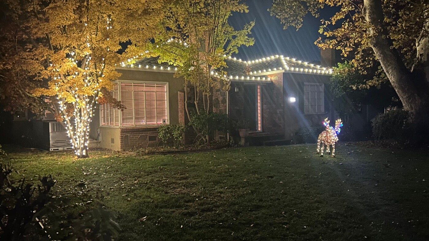 Christmas light installation in Sacramento, CA: farmhouse multicolor dusk